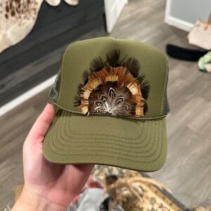 Turkey feather trucker hat.